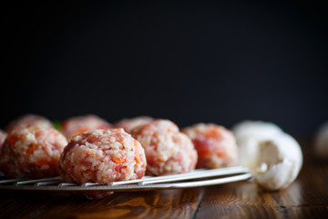 raw meatballs tangled meat with carrots