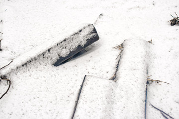 wooden railway sleepers covered in snow