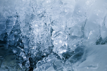 Fototapeta na wymiar Texture of a frozen ice in a nature
