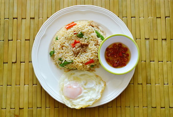spicy fried rice pork and basil leaf with fried egg on dish