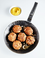 German frikadelle or meatballs served in a skillet