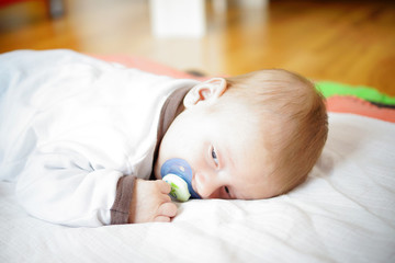 Little boy with blue pacifier