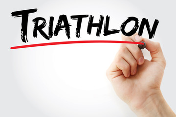 Hand writing Triathlon with marker, sport concept background