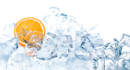 Fresh orange in ice cubes background.