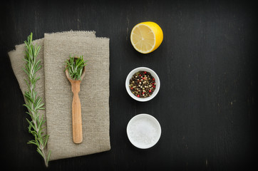 Rosemary with wooden spoon and spices