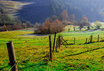 Autumn Landscape, wooden fence and blue mountains in the backgro