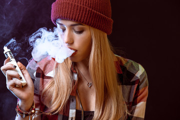 young woman smoking electronic cigarette