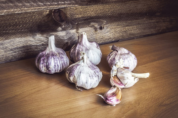 Garlic on vintage wooden background