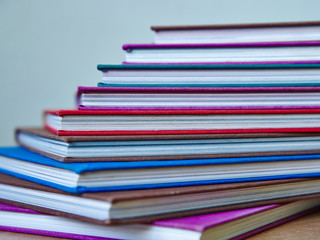 digonal pile of multicolored hardcover books