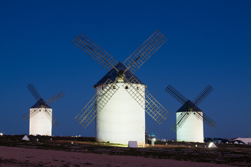 windmills at field in night