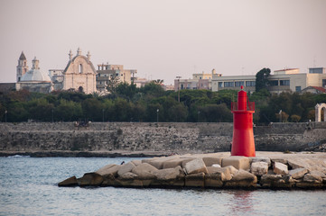 porto veduta con faro, villa e chiesa