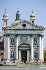 Fototapeta na wymiar South facade of the cathedral of Santa Maria della Salute in Venice, Italy. Built by Baldassare Longhena.
