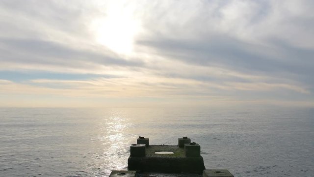 Concrete pier with scenery sea view at sunset