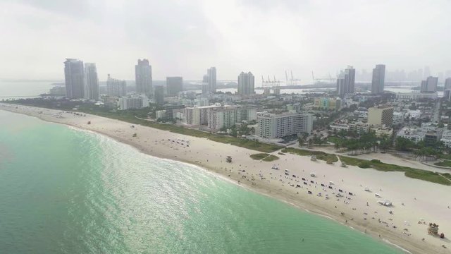 South Beach Miami Florida USA Aerial Establishing Shot Overhead Above Water to Beach