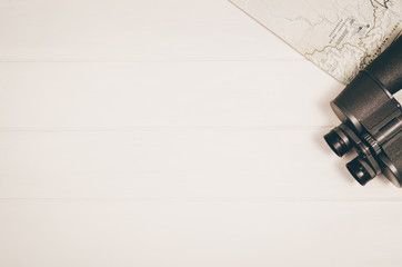Accessories for travel top view on white wooden background with copy space. Adventure and...