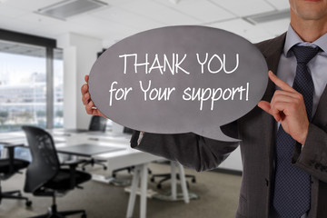 Thank you for your support. Businessman holding blackboard. Business vision, success, team work, leadership concept