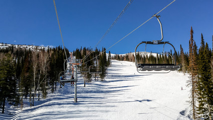 Ski lift and ski slope at a ski resort in Sheregesh, Russia.