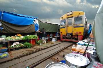 Fresh market on the railroad track, Mae Klong train station, Thailand