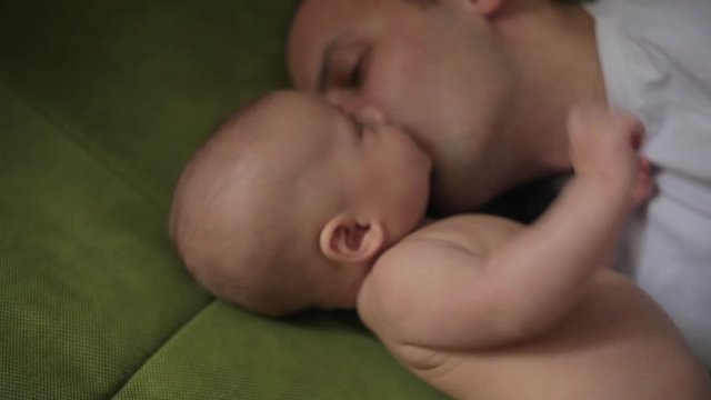 Dad is sleeping, and his son woke up