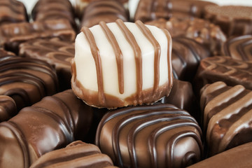 Mix of tasty chocolate candies - close up image.