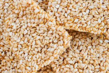 Sesame seeds in honey - macro background image.