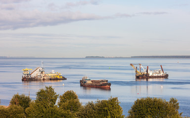 cargo ships with construction equipment