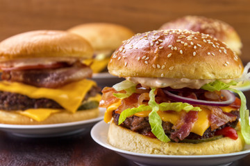 Group of different burgers on dish closeup