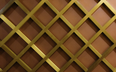 Wall décor by golden wood diamond pattern on red wall