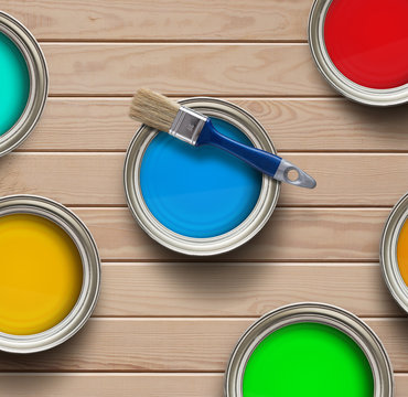 Home improvement, colorful paint cans on the wooden floor