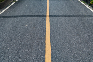 Fototapeta premium Asphalt road with yellow line