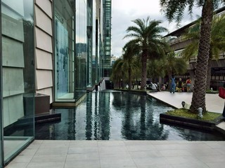 Plaza with palm trees in Bangkok, Thailand