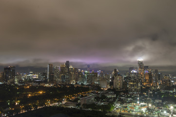 Fototapeta premium Aerial view of Bangkok city, under storm cloudy sky