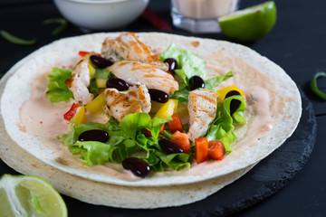 Chicken with vegetables wrapped in a tortilla