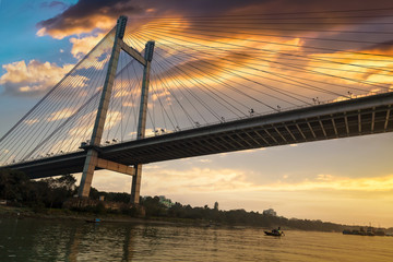 Fototapeta na wymiar Vidyasagar Setu (bridge) as seen from a boat on river Hooghly at dusk