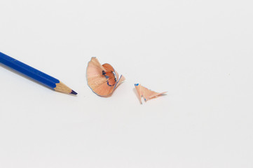 Fractions blue pencil from sharpener and blue pencil