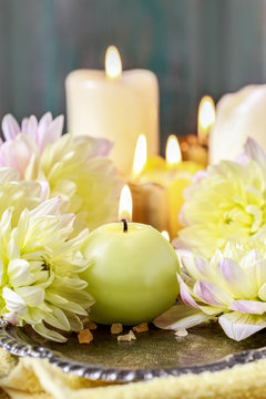 Candles and golden dahlias
