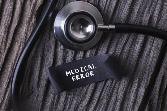 Medical Concept- MEDICAL ERROR word written on label tag with Stethoscope