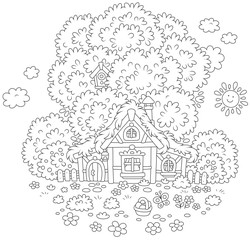 Small old hut with a thatched roof under a big tree on Easter day