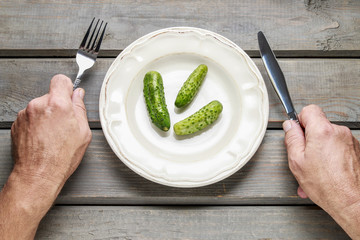 Pickled cucumbers on plate
