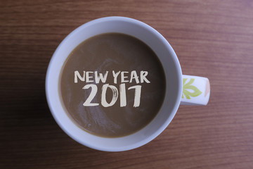 NEW YEAR 2017 on coffee in cup.