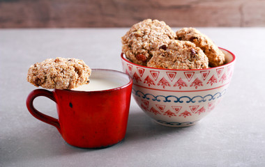 Cup of milk and wholewheat, oat and coconut cookie