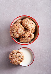 Cup of milk and wholewheat, oat and coconut cookie
