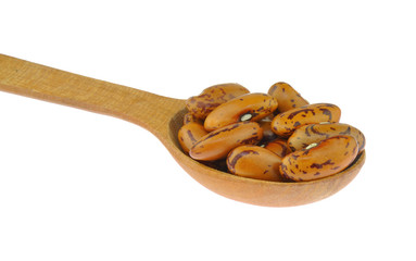 Pinto beans in wooden spoon
