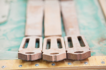 three unfinished vulture guitar at workshop for the production of guitars
