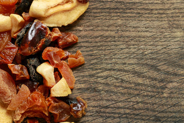 Dried fruits on wooden background