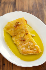 fried cod fish with garlic and olive oil