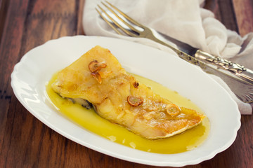 fried cod fish with garlic and olive oil