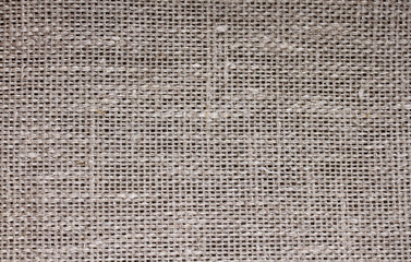 background of coarse linen with a texture of threads and weaves