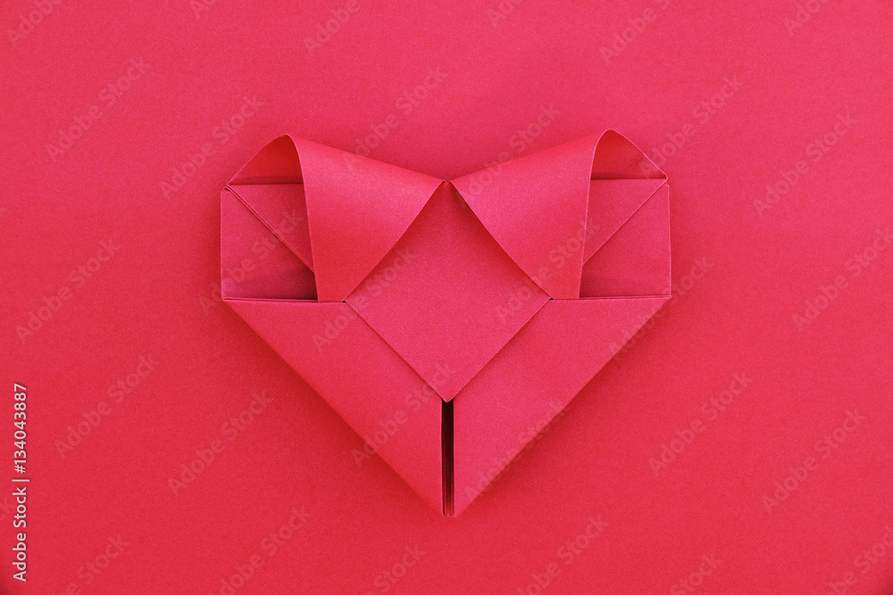 Poster one folding red paper heart on red for pattern and background