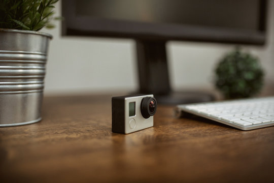 Gopro Camera Standing On Desk